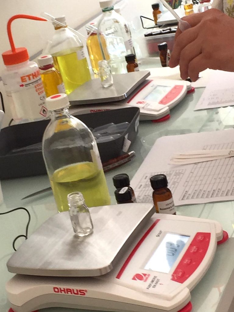 In the perfume laboratory showing bottles of ingredients