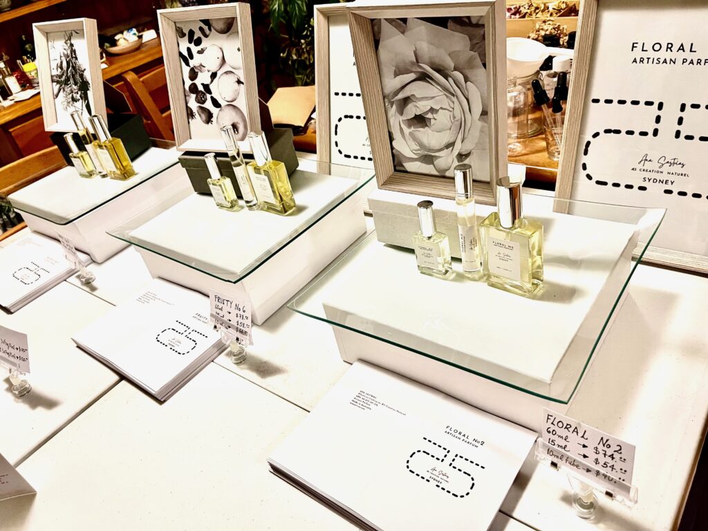 Exhibition Table with Ana Sastrias Perfume Fragrances: Floral No2, Fruity No6 and Woody No7